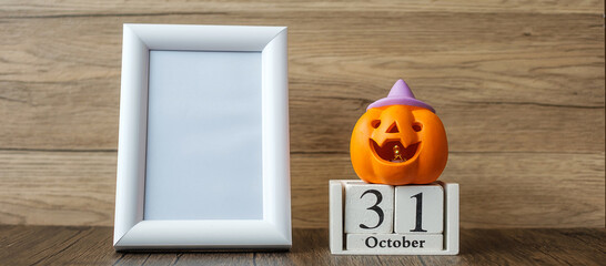 Orange pumpkin, 31 October calendar and frame with copy space for text. Happy Halloween day, Hello October, fall autumn season, Festive, party and holiday concept
