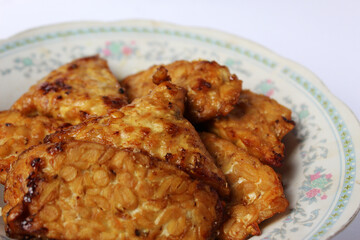 fried tempeh healthy food golden tasty, soybeans fermented, close up images, background texture