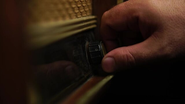 Searching For Radio Station Frequency on Old Vintage Radio Receiver From 1950s. Close Up, Selective Focus, Full Frame