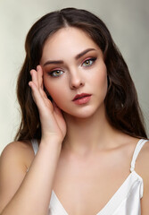 Beauty portrait of young woman. Brunette girl with evening female makeup.