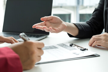 Business people hold a resume and talk to job applicants for job interviews about careers and Their...
