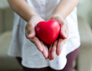 Woman hands and holding red heart, health, medicine and love concept.