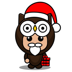cartoon vector illustration of cute owl animal mascot costume character wearing a christmas hat and holding a gift