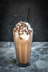 Coffee with Ice cream, milk and chocolate on abstract background.