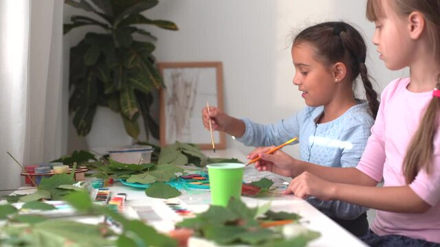 autumn craft for kids. animal Fox made from maple leaf. childrens art and creative. handicraft made from natural materials. girls draws with paints.
