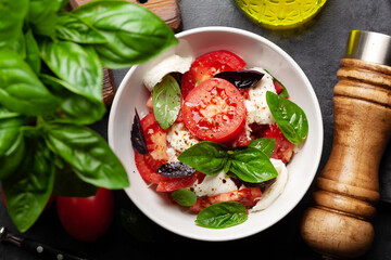 Caprese salad with fresh tomatoes, garden basil and mozzarella cheese