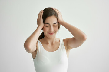 woman holding her head migraine health problems stress negative