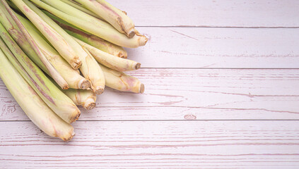 Top view of fresh lemongrass on a wooden table with copy space for text. Flat lay. Herbal and healthcare concept
