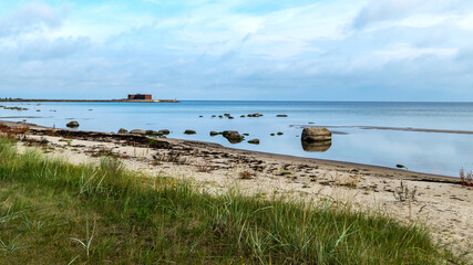 Fototapeta na wymiar The unusual landscape of Kaltene beach, formed by large boulders covering the coast, morning hour, Kaltene rocky seashore, Latvia