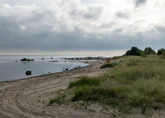 The unusual landscape of Kaltene beach, formed by large boulders covering the coast, morning hour, Kaltene rocky seashore, Latvia