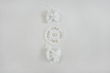 White embroidered wedding towels on a white background.