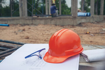 Safety helmet (hard hat), blueprint, glasses, and drawings paper for engineer, safety officer or...