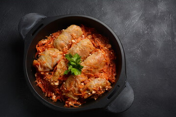 Cabbage rolls stuffed with ground beef and rice in tomato sauce