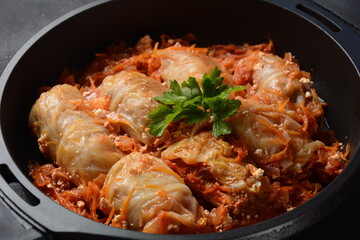 Cabbage rolls stuffed with ground beef and rice in tomato sauce