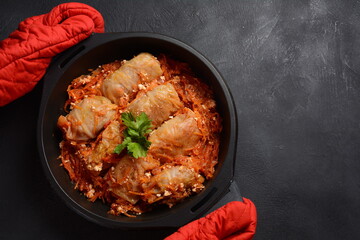 Cabbage rolls stuffed with ground beef and rice in tomato sauce