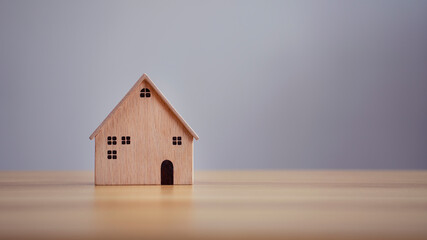 Obraz na płótnie Canvas House wood model on table background, Planning to buy property.