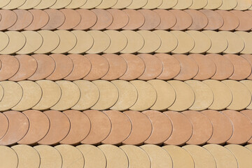 Floor with round shapes of cream-colored cement
