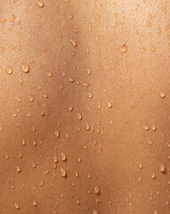 Water drops on the girl's skin.