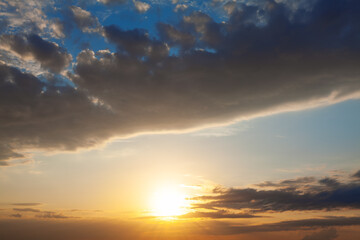 Sunset with dark clouds . Glowing on the evening sky 