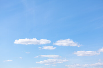 Obraz premium Clouds at clear blue sky . Rare white clouds on the blue heaven 