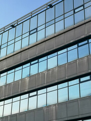 Blue glass on the windows of the building