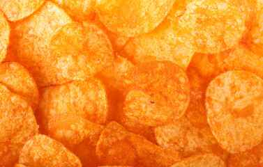 Red paprika potato chips screen filling closeup background 