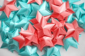 Folding ribbon pile in star shape patterns on white background