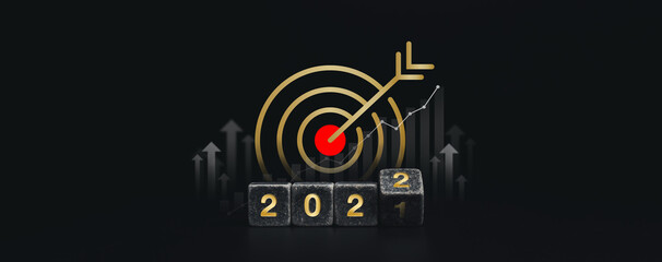 2022 Happy New year and successful concept banner with big golden goal target icon symbol on the gold 2022 numbers on flipping black dice blocks with uprising arrows on dark background, minimal style.