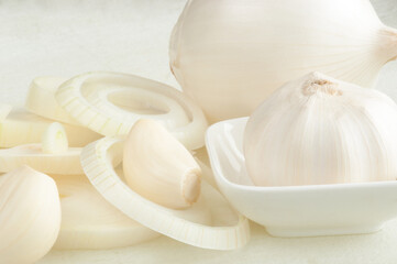 Garlic and onions on a white background