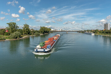 Fototapeta na wymiar Barge transporting goods on the Rhine between France and Germany.