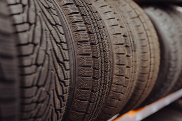 Row of new car tyres in a auto shop