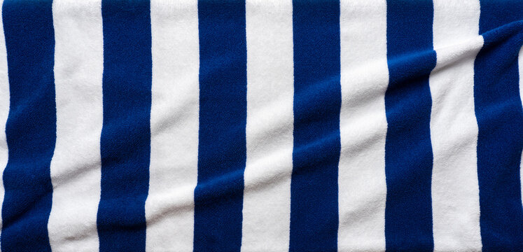 Blue stripes beach towel  mock up isolated on white background, flat lay top view shot