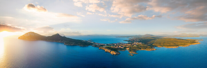 View from above, aerial shot, stunning panoramic view of Golfo Aranci during a beautiful sunrise....