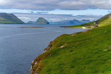 View of Hestur and Koltur Islands across the Hestfjord from the village of Kirkjub&oslash;ur (Kirkeb&oslash;) on Streymoy island, Faroe Islands.