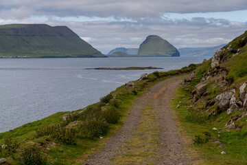 View of Hestur and Koltur Islands across the Hestfjord from the village of Kirkjub&oslash;ur (Kirkeb&oslash;) on Streymoy island, Faroe Islands.