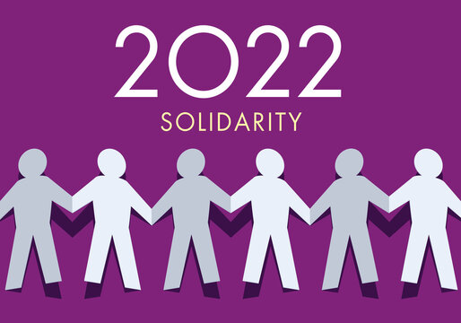Une origami qui représente un groupe de personnes qui se donnent la main en signe de solidarité pour l’année 2022.