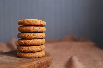 Fototapeta na wymiar Stack of cookies on wooden board