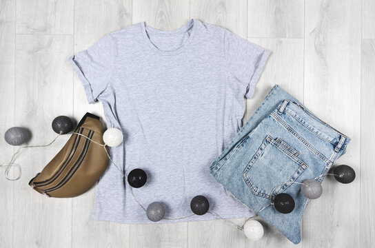 Blank gray t-shirt mockup. Bella canvas mock up with jeans and leather bag.