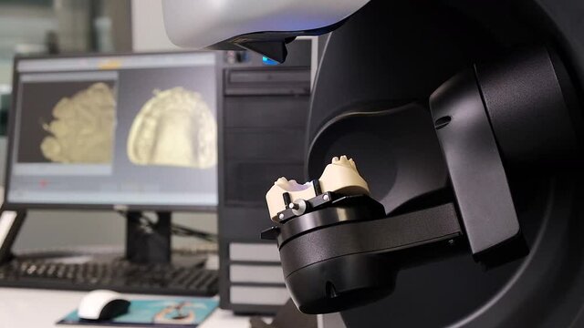 CAD CAM equipment modern extraoral laboratory dental scanner. Selective focus.