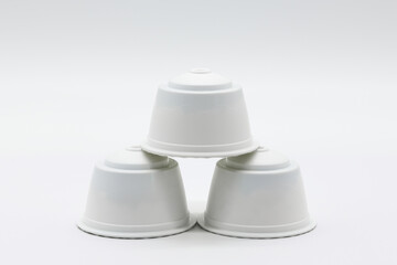 Three Generic Coffee Milk pods for coffee machines on a white background.
