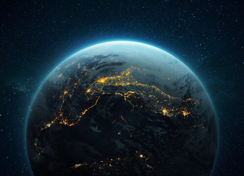 Amazing blue planet Earth with night yellow lights of megacities in space with stars. Deep space with a planet. Civilization concept. Cities of Central Europe