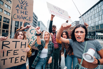 fridays for future protest on city street - young activists movement against global warming