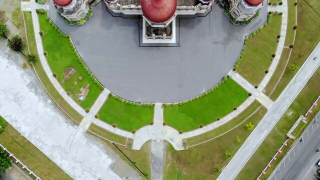 Aerial video of the Baitul Makmur Grand Mosque, West Aceh, showing the mosque grounds from above with the drone moving upwards