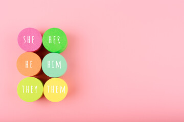 Correct pronouns for different genders on light pink background with copy space