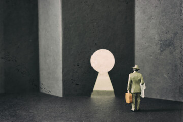 Abstract image of person walking to wall with keyhole