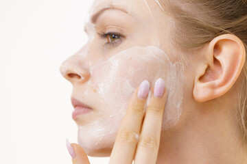 Girl apply cream cosmetic