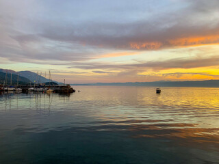 Fantastic colors of the sunset, colorful clouds and sky reflection on the surface of the water, magic lake, natural background, wallpaper