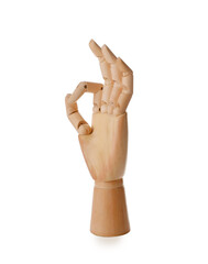 Wooden mannequin hand showing okay gesture on white background