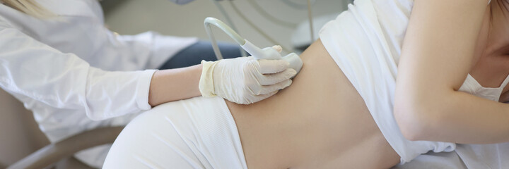 Ultrasound scanner device in hand of professional doctor examining his patient