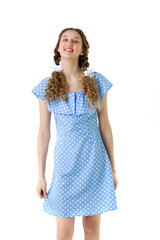 Portrait of cheerful teen girl in light blue dress